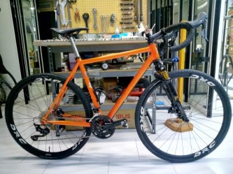 Orange plus Gravel bicycle frame in steel, silver fillet brazed technique, numbered frame