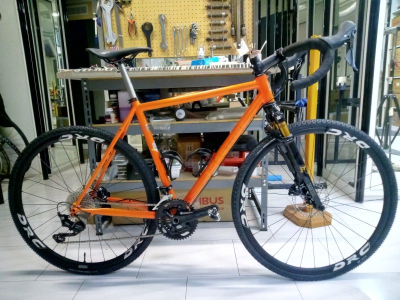 Orange plus Gravel bicycle frame in steel, silver fillet brazed technique, numbered frame