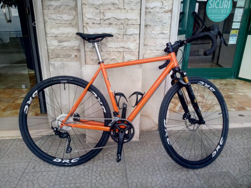 Orange plus Gravel bicycle frame in steel, silver fillet brazed technique, numbered frame